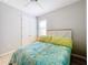Bright bedroom with a double bed and built in closet at 17863 Passionflower Cir, Clermont, FL 34714