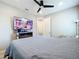 Bedroom with a double bed and a large flat-screen TV at 17863 Passionflower Cir, Clermont, FL 34714