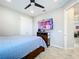 Bedroom with a double bed, dresser, and a flat screen TV at 17863 Passionflower Cir, Clermont, FL 34714