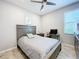 Bedroom with double bed, ceiling fan, and a flat screen TV at 17863 Passionflower Cir, Clermont, FL 34714