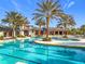 Large community pool with lap lanes and a lounging area at 17863 Passionflower Cir, Clermont, FL 34714