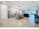 Bright dining room with chandelier and view to living room at 17863 Passionflower Cir, Clermont, FL 34714