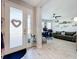 Bright entryway with glass front door and view into a living area at 17863 Passionflower Cir, Clermont, FL 34714