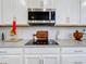 Modern kitchen features with sleek countertops and stainless steel appliances at 17863 Passionflower Cir, Clermont, FL 34714