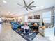 Open living room with view to kitchen and backyard at 17863 Passionflower Cir, Clermont, FL 34714