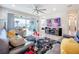 Spacious living room with sliding glass doors and view of backyard at 17863 Passionflower Cir, Clermont, FL 34714