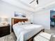 Main bedroom with king bed and access to a walk-in closet at 17863 Passionflower Cir, Clermont, FL 34714