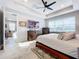 Spacious main bedroom with large bed and en-suite bathroom at 17863 Passionflower Cir, Clermont, FL 34714