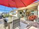Covered patio with outdoor seating and dining areas at 17863 Passionflower Cir, Clermont, FL 34714