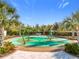 Fun spray park for with palm trees and seating at 17863 Passionflower Cir, Clermont, FL 34714