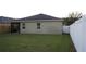 Grass backyard with privacy fence at 180 Daigledog St, St Cloud, FL 34772