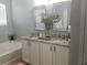 Double vanity bathroom with granite countertops at 180 Daigledog St, St Cloud, FL 34772