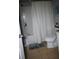 Clean bathroom with a shower/tub combo and white vanity at 180 Daigledog St, St Cloud, FL 34772