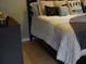 Cozy bedroom with a plush bed and neutral color scheme at 180 Daigledog St, St Cloud, FL 34772