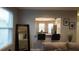 Living room with view into kitchen and breakfast area at 180 Daigledog St, St Cloud, FL 34772