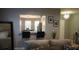 Living room with view into kitchen and breakfast area at 180 Daigledog St, St Cloud, FL 34772