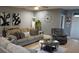 Spacious living room featuring a comfy sofa and accent chairs at 180 Daigledog St, St Cloud, FL 34772