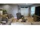 Living room with comfy seating and French doors at 180 Daigledog St, St Cloud, FL 34772