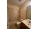Bathroom featuring a single sink vanity, tile floors and a tub/shower combination at 1919 Bentley Blvd, Kissimmee, FL 34741