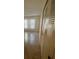 Cozy bedroom featuring tile floors, a closet, and a bright window with natural light at 1919 Bentley Blvd, Kissimmee, FL 34741