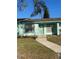 Charming single-story home with manicured lawn and walkway leading to the front door at 1919 Bentley Blvd, Kissimmee, FL 34741