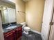 Small half bathroom with dark vanity and tile floor at 2007 Dixie Belle Dr # 2007 I, Orlando, FL 32812