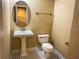 Bathroom with pedestal sink, toilet and patterned floor at 2007 Dixie Belle Dr # 2007 I, Orlando, FL 32812