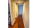 Hardwood floor hallway with access to bedrooms and bath at 2007 Dixie Belle Dr # 2007 I, Orlando, FL 32812