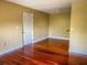 Hardwood floor living room with access to kitchen and entryway at 2007 Dixie Belle Dr # 2007 I, Orlando, FL 32812