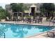 Refreshing community pool with lounge chairs at 2007 Dixie Belle Dr # 2007 I, Orlando, FL 32812