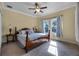 Cozy bedroom with a ceiling fan, natural light, and carpeted floors for added comfort at 2223 Amherst Ave, Orlando, FL 32804