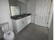 Bathroom with granite countertop and double vanity at 231 Tarpon Bay Blvd, Haines City, FL 33844