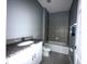 Bathroom with granite vanity, tiled shower and tub at 231 Tarpon Bay Blvd, Haines City, FL 33844
