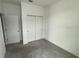 Bright bedroom with double door closet and neutral carpeting at 231 Tarpon Bay Blvd, Haines City, FL 33844