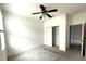 Simple bedroom with neutral walls, carpeting, and a ceiling fan at 231 Tarpon Bay Blvd, Haines City, FL 33844