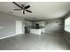 Open-concept living area with tile floors and a ceiling fan at 231 Tarpon Bay Blvd, Haines City, FL 33844