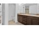 Spacious bathroom with double vanity, tile flooring, and bright lighting at 2617 Amati Dr, Kissimmee, FL 34741