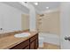 Bright bathroom featuring a shower and bathtub combo with a neutral colored tile surround at 2617 Amati Dr, Kissimmee, FL 34741