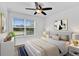 Bright bedroom features a large window, neutral decor, carpet, and a ceiling fan at 2617 Amati Dr, Kissimmee, FL 34741