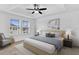 Beautiful bedroom with ceiling fan, tray ceilings and large windows at 2617 Amati Dr, Kissimmee, FL 34741