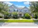Charming two-story home with well-manicured lawn, landscaping, covered porch, and inviting entrance at 2617 Amati Dr, Kissimmee, FL 34741