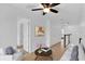 Upstairs hallway with neutral walls, tile floors, a sitting area, and multiple closets at 2617 Amati Dr, Kissimmee, FL 34741