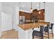 Modern kitchen featuring granite countertops, stainless steel appliances, and breakfast bar with pendant lighting at 2617 Amati Dr, Kissimmee, FL 34741