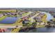 Aerial view showcasing a lakefront community with many houses at 2821 Rialto Ct, Kissimmee, FL 34746