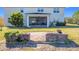 Home's backyard with patio and screened enclosure at 2821 Rialto Ct, Kissimmee, FL 34746