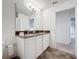 Bathroom with double vanity, granite countertop, and tile flooring at 2821 Rialto Ct, Kissimmee, FL 34746