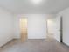 Well-lit bedroom with carpet and access to closet and hallway at 2821 Rialto Ct, Kissimmee, FL 34746