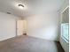 Bright bedroom with window, neutral walls and carpet at 2821 Rialto Ct, Kissimmee, FL 34746