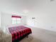 Bright bedroom featuring a red and black plaid comforter at 2821 Rialto Ct, Kissimmee, FL 34746