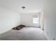 Simple bedroom with grey carpet and window at 2821 Rialto Ct, Kissimmee, FL 34746